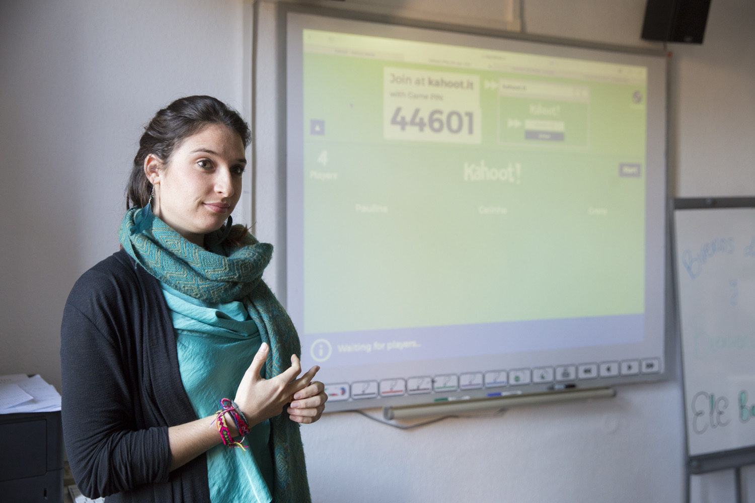 A teacher running a class in Spain