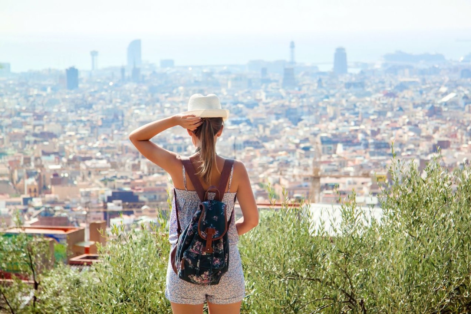 A traveller looking out over Barcelona and the Mediterranean